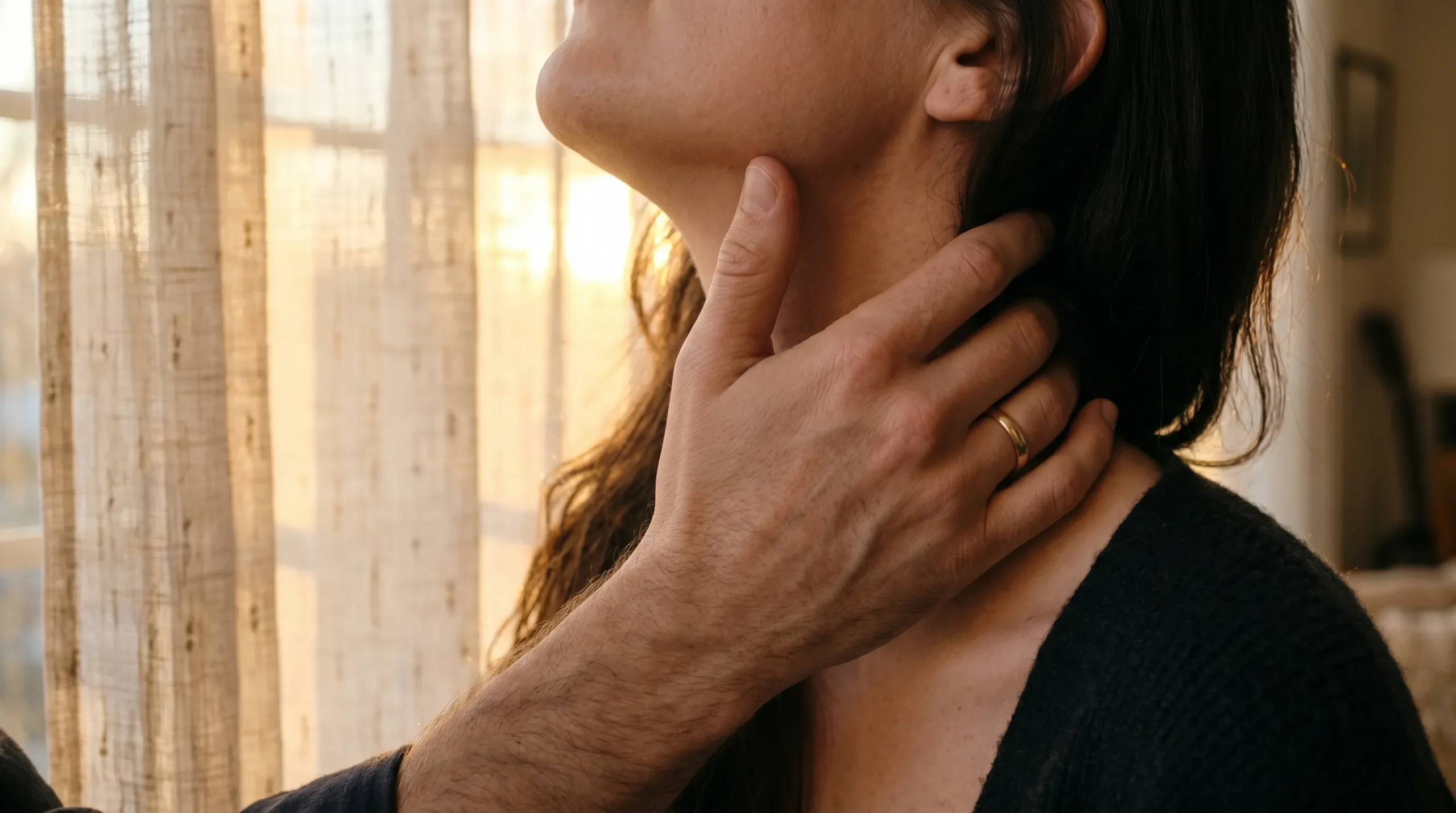 Praise kink romance books - intimate hand cradling jaw in soft golden light
